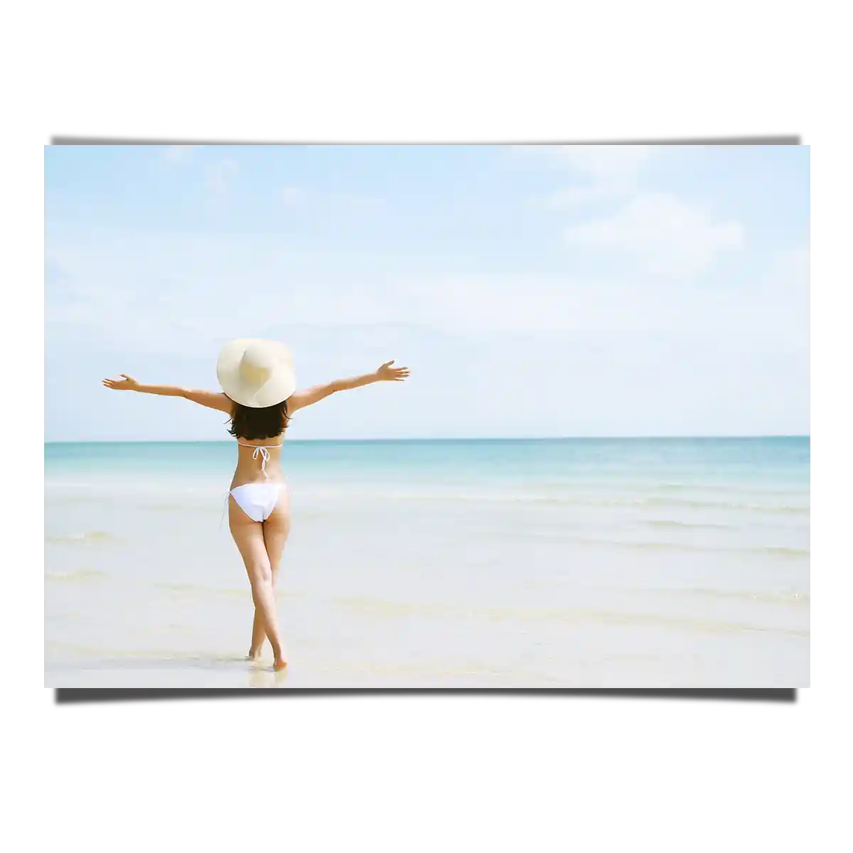 Woman Enjoying The Beach View With Wide Arms Open