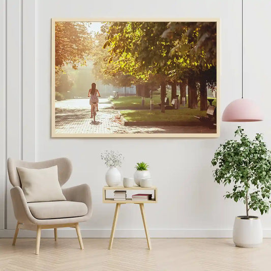 Girl Riding Bicycle at the Park with Trees in Morning Warm Sun