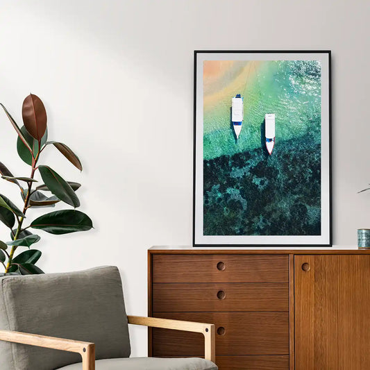 Boats on clear water beach from top view