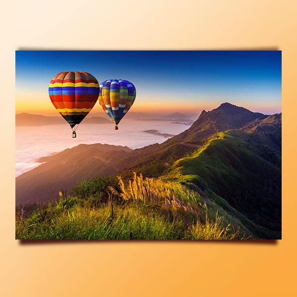 Hot air balloons over mountains