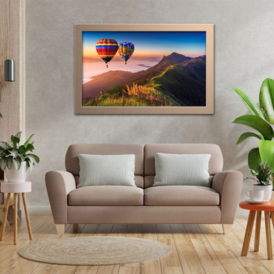 Hot air balloons over mountains