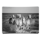 Herd of White Camargue Horses Running Along Water in Black and White