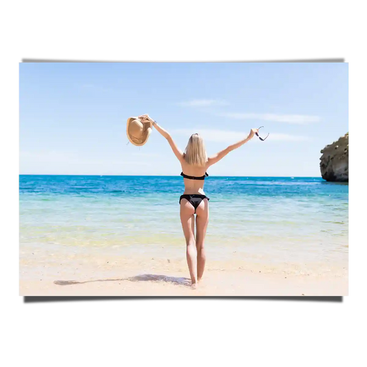 White Sand Beach View with a Woman Open Arms Standing Under the Sun