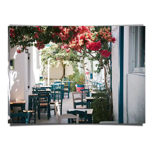Summer Scene of Outdoor Street Cafe with Hanging Flowers in Greece