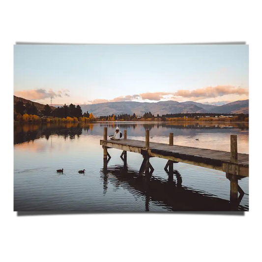 Lake Pier with Ducks and Woman Sitting with Guitar in Cromwell New Zealand