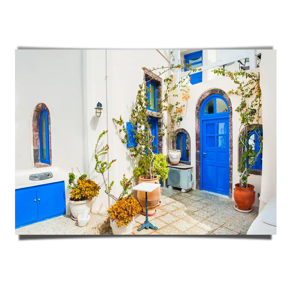 Traditional Greek White Architecture with Blue Doors and Windows in Santorini Island Greece