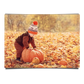 Little Boy Harvesting Orange Pumpkin in Autumn Leaves