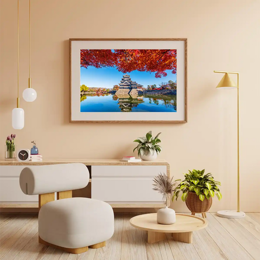 Matsumoto Castle with Maple Leaves at Autumn Reflecting on Water in Nagano Japan