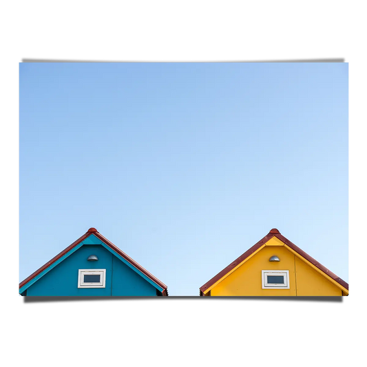 Peeping Beach House Rooftops Over Clear Blue Skies